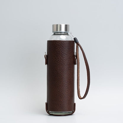 Leather water bottle holder with strap and glass bottle